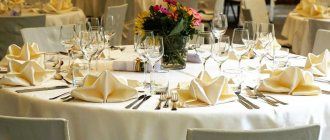 Tables set with dishes and decorated with bouquets